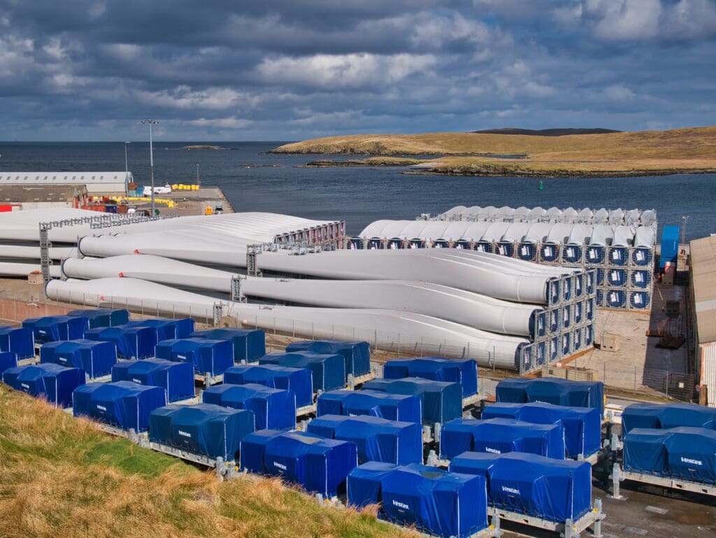 Power is flowing from the Shetland Isles to mainland Britain for the first time, thanks to the UK's most productive onshore windfarm, Viking, which has come on stream.
